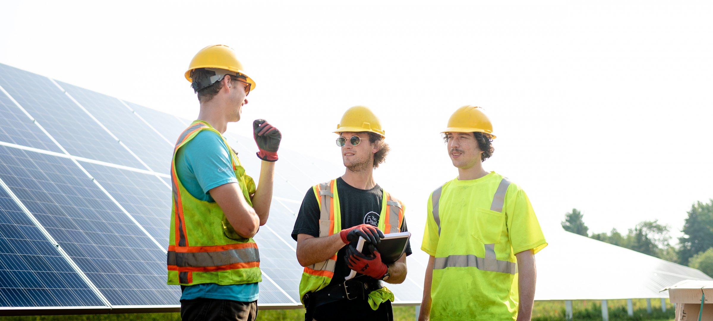 Students in hard hats at a construction site.