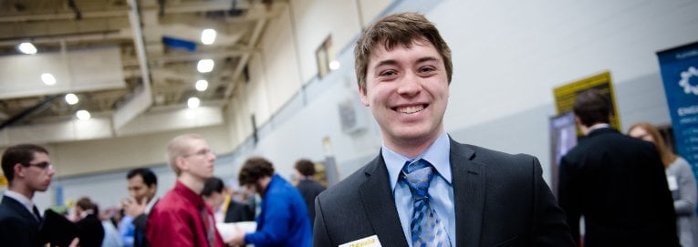 Student smiling at career fair