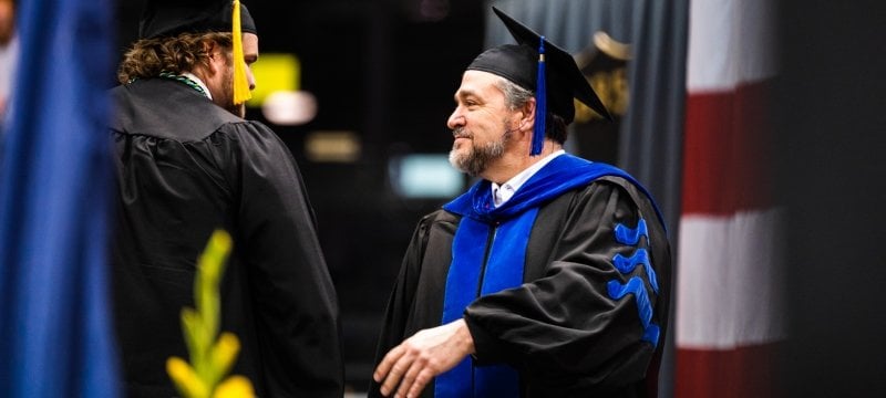 Student and Dean Johnson at Commencement