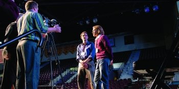 Students talking in front of a camera
