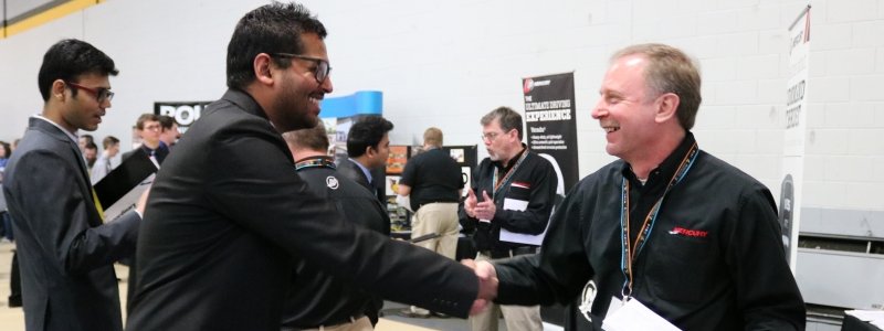 Student shaking hands with recruiter at Career Fair