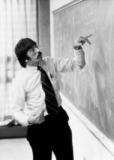Anton Pintar teaching near a blackboard.
