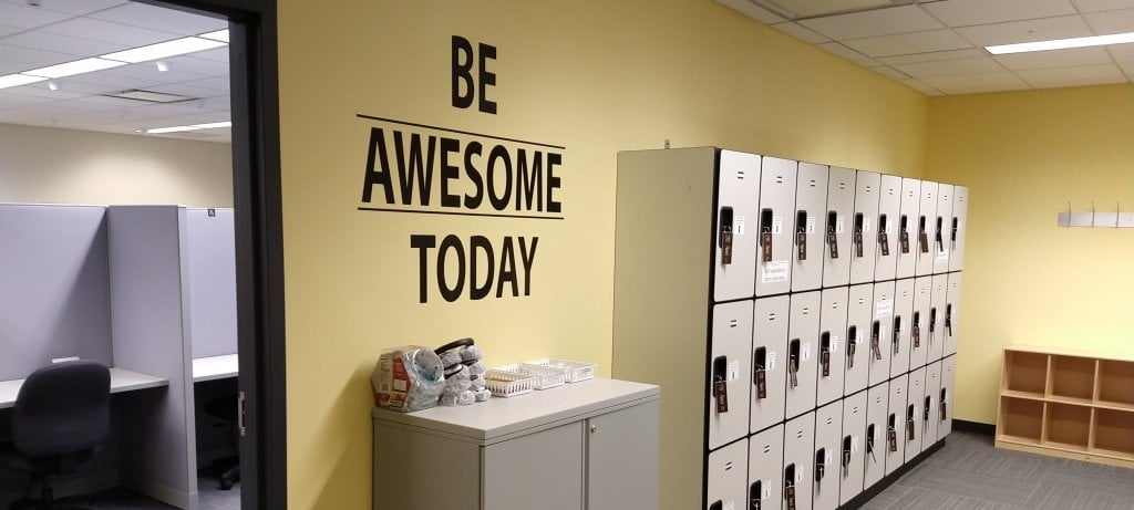 Testing Center room with lockers and Be Awesome Today on the wall.