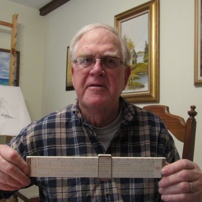Ron Sorensen with his slide rule.