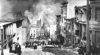 Street scene with people watching a fire.