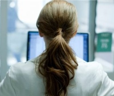 Healthcare worker at a computer
