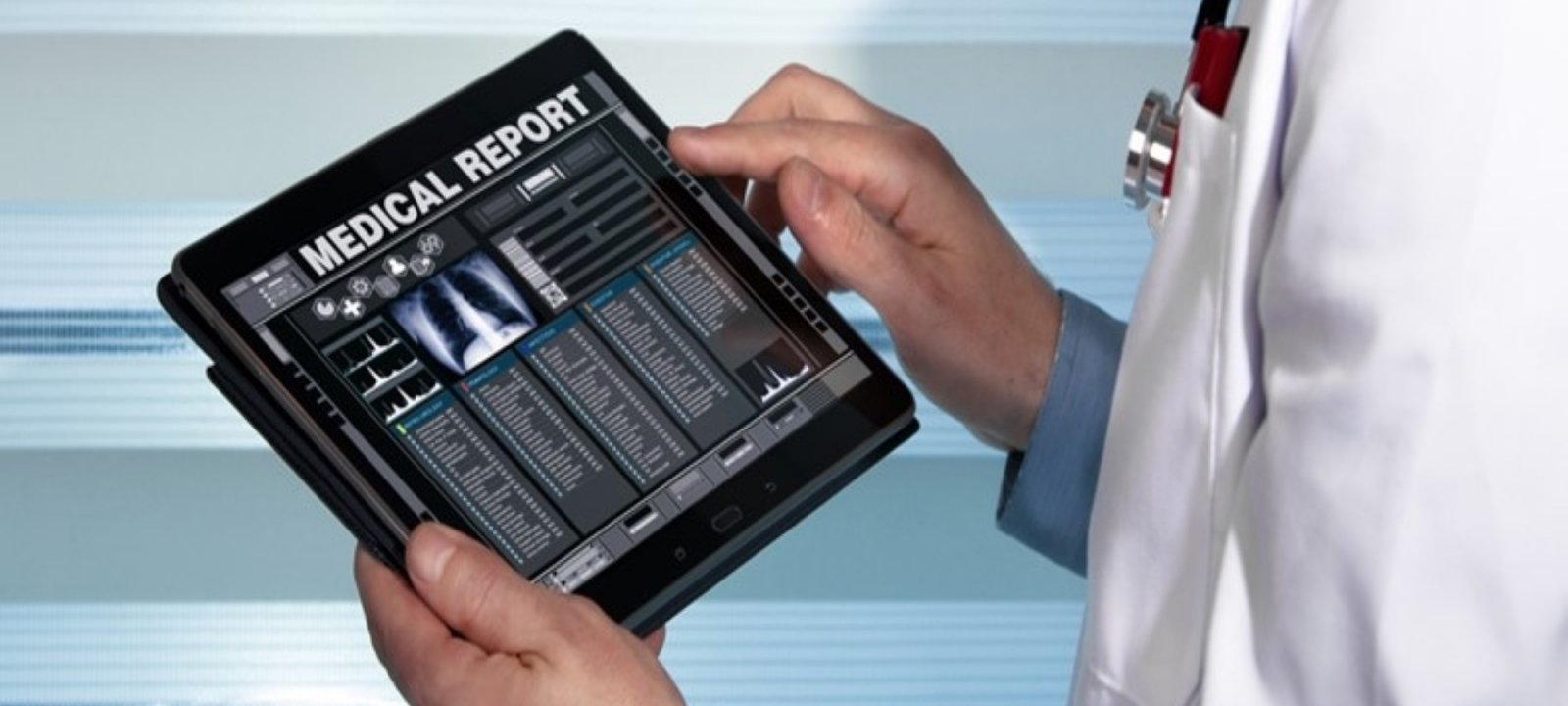 A doctor looking at an electronic health record on a tablet.