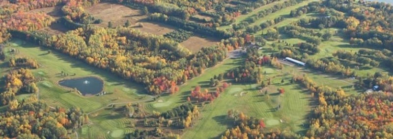 Aerial of the Portage Lake Golf Course during a sunny fall day.