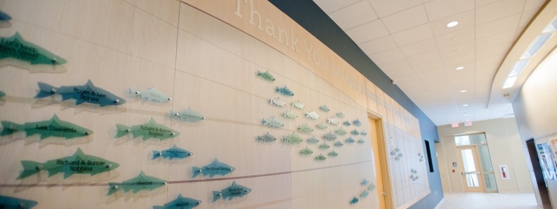 Engraved fish on the main hallway in the GLRC with Thank you text above.