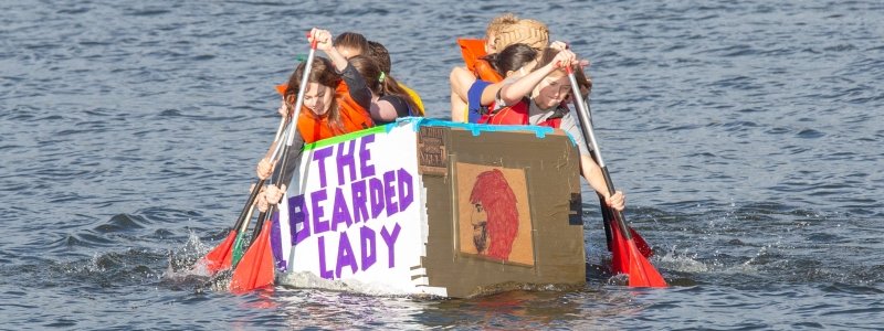 Freshman Experience Students Racing a Cardboard Boat