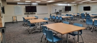 G42W tables and chairs with televisions on the walls.