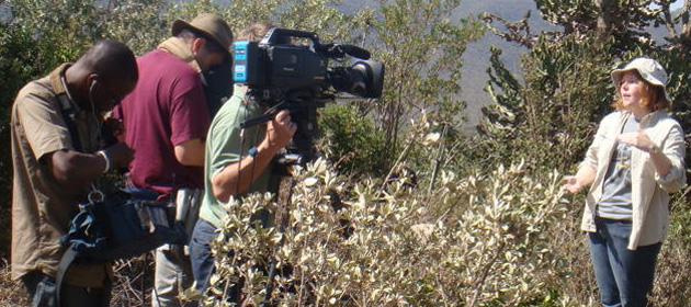 PhD student Alex Guth on camera for National Geographic in Kenya.