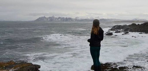 Student looking out into a choppy sea.
