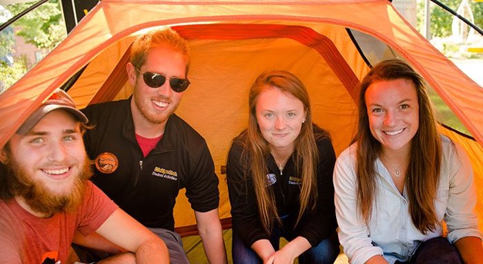 Students in a tent.