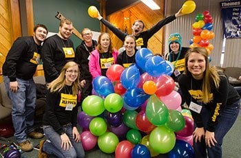 Leadershape participants with balloons.