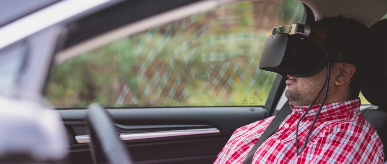 Student in a car with 3-D virtual reality display.