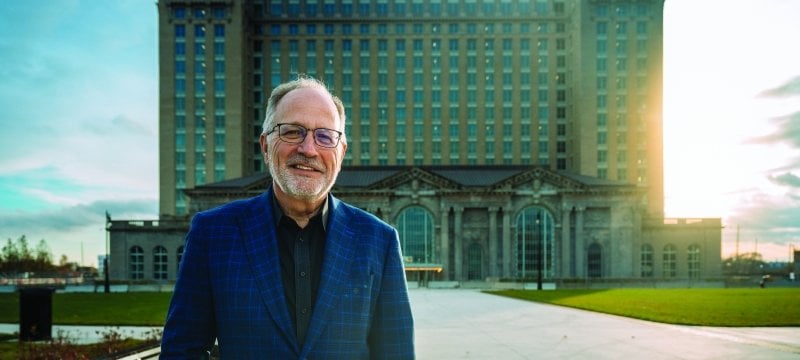 Ron Staley standing in front of Michigan Central Station.