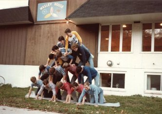 A human pyramid in front of Wesley House