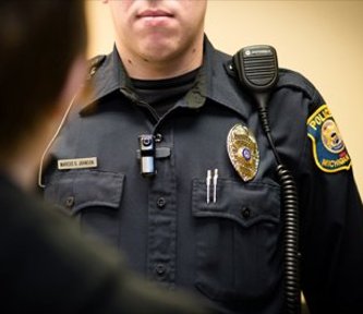Public Safety officer wearing a lapel camera.