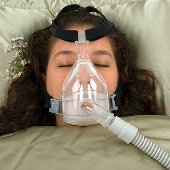 Person wearing CPAP mask.