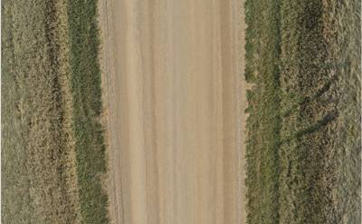 Aerial view of an unpaved road.