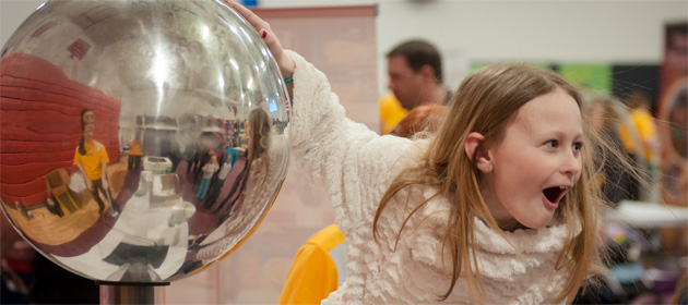 Touching a Van de Graff generator