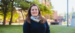 Laura Sieders standing outside on campus.