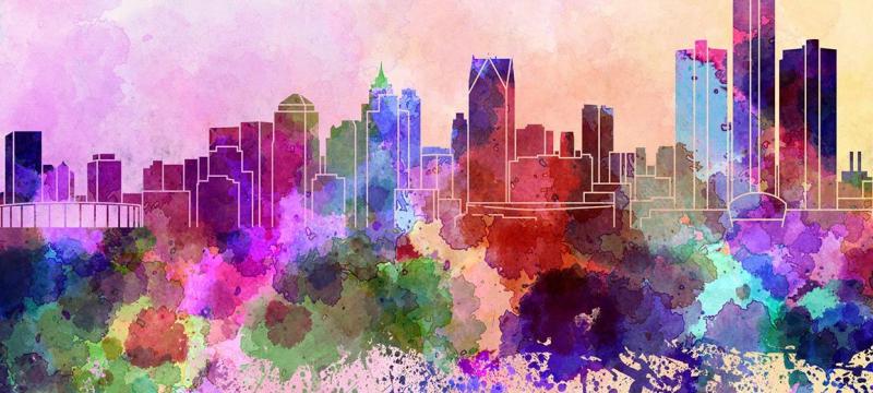 Illustrated city skyline in rainbow colors.
