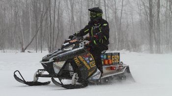 A rider on Michigan Tech's electric sled.
