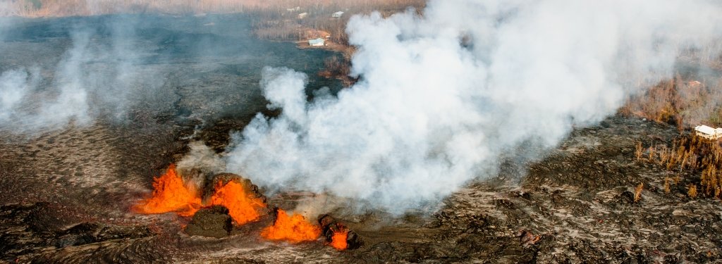 Lava erupts from fissures in KÄ«lauea's Lower East Rift Zone near a housing development. Image credit: Greg Waite
