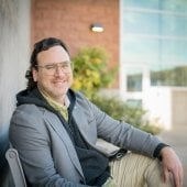 Timothy Havens sits outside the GLRC