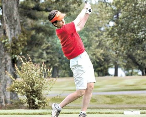 Associate Professor Michele Miller tees off at PLGC during UPLGA Championship, July 2009. Photo courtesy of the Daily Mining Gazette.