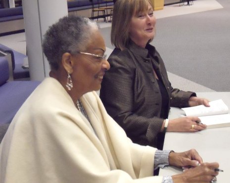 Evangeline Moore and Susan Carol McCarthy at booksigning in the Rozsa Center