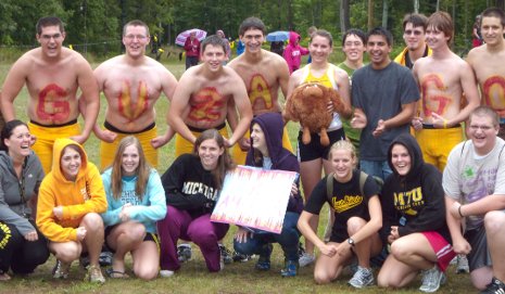 Amanda Guza is surrounded by First Year Experience friends.