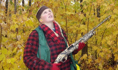 Graduate student Tara Bal prepares to shoot maples leaves down from the forest canopy