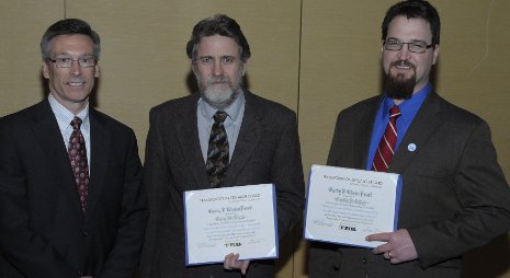 Terry McNinch, center, and Tim Colling (right) receive Transportation Research Board Charley Wootan Award from Robert Johns, chair, Technical Activities Council.   Photo: Transportation Research Board