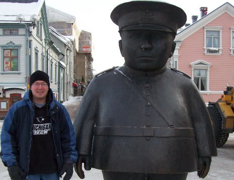 Michigan Tech chemical engineering undergrad Eric Neff makes the acquaintance of the famous Toripolliisi ("Bobby in the Market") statue that watches over  the Market Square of Oulu, Finland, where Neff is an exchange student. 