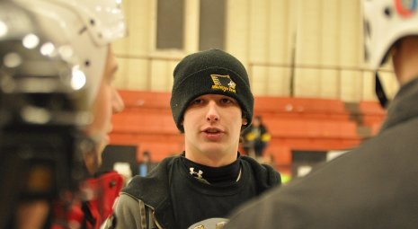 Brad Nedrow, on-ice coordinator for human ice bowling, gives instructions at Dee Stadium.