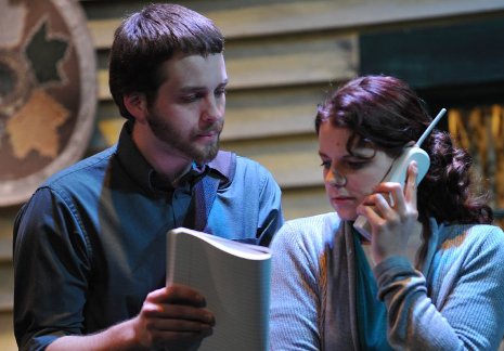 Tech students Frank Sopjes and Nicole Kangas look over the professor's notebook.