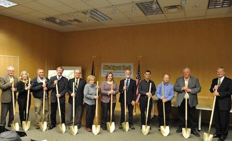 Stormy weather forced dignitaries inside for Seaman Mineral Museum groundbreaking ceremonies but did nothing to dampen their spirits. Sam Bekker photo