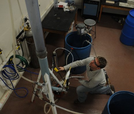 Chemical engineering grad student Brett Spigarelli and the CO2 scrubber he helped to design.