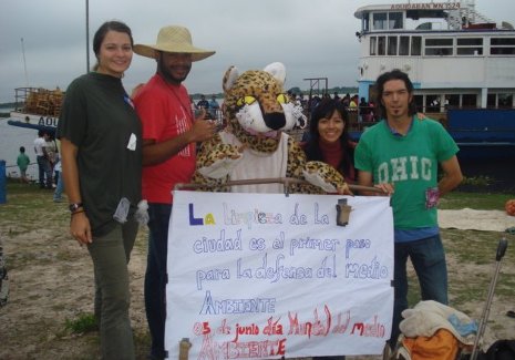 Clean Up Streets Peace Corps volunteer Michelle Cisz in Paraguay with local volunteers and their mascot, a jaguar used by the volunteers to get people interested in their community projects, like this street clean-up campaign.
