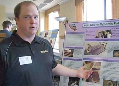 Shawn Bretting, a Senior Capstone Design team member, explains his team's Fernstrum keel cooler dynamic fatigue resistance project.