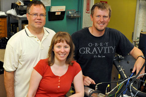 High school teachers Karl Balke, Mandy Frantti, and Todd Waurio in the flex-fuel engine lab.