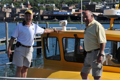 Bud Rieckhoff, Mark Jarmus, Reunion 2010 Bud Rieckhoff '60 and Mark Jarmus '80 tour the Keweenaw Waterway aboard Tech's research vessel, the Agassiz, during Reunion 2010.