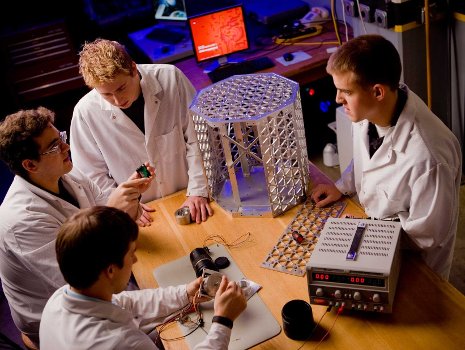 Students in Michigan Tech's Aerospace Enterprise building a satellite