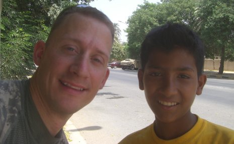 Major Don Makay '99 with an Iraqi, part of his Iraqi Hope Foundation.