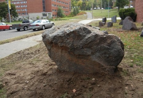 Rocks mark the spot where Michigan Tech's new Mining Boulder Garden is taking shape. The three-ton Sudbury boulder is in the foreground. Dennis Walikainen photo