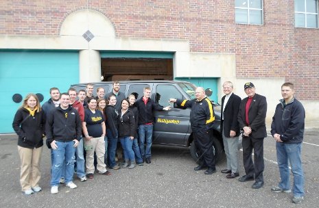 Husky Motors Donates Van George Butvilas, facilities director, hands the keys for a van to student Erik Wachlin. Pictured, right to left, are Nicholas Hendrickson, School of Technology; Institute for Leadership and Innovation director Robert Warrington; and President Glenn Mroz.