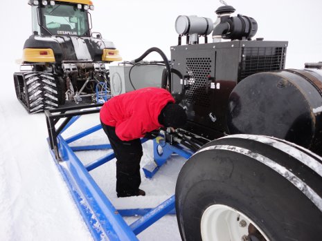 Cold duty Russ Alger checking out the SnowPaver equipment